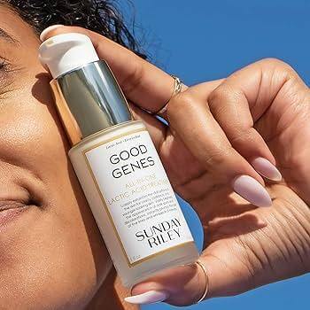 Sunday Riley Good Genes Glycolic Acid Treatment 15ml held near the face, showcasing its exfoliating benefits for bright skin.