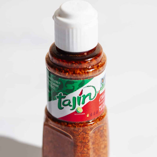 Tajin Chilli and Lime Seasoning bottle with 142g spice blend for flavorful cooking and seasoning.