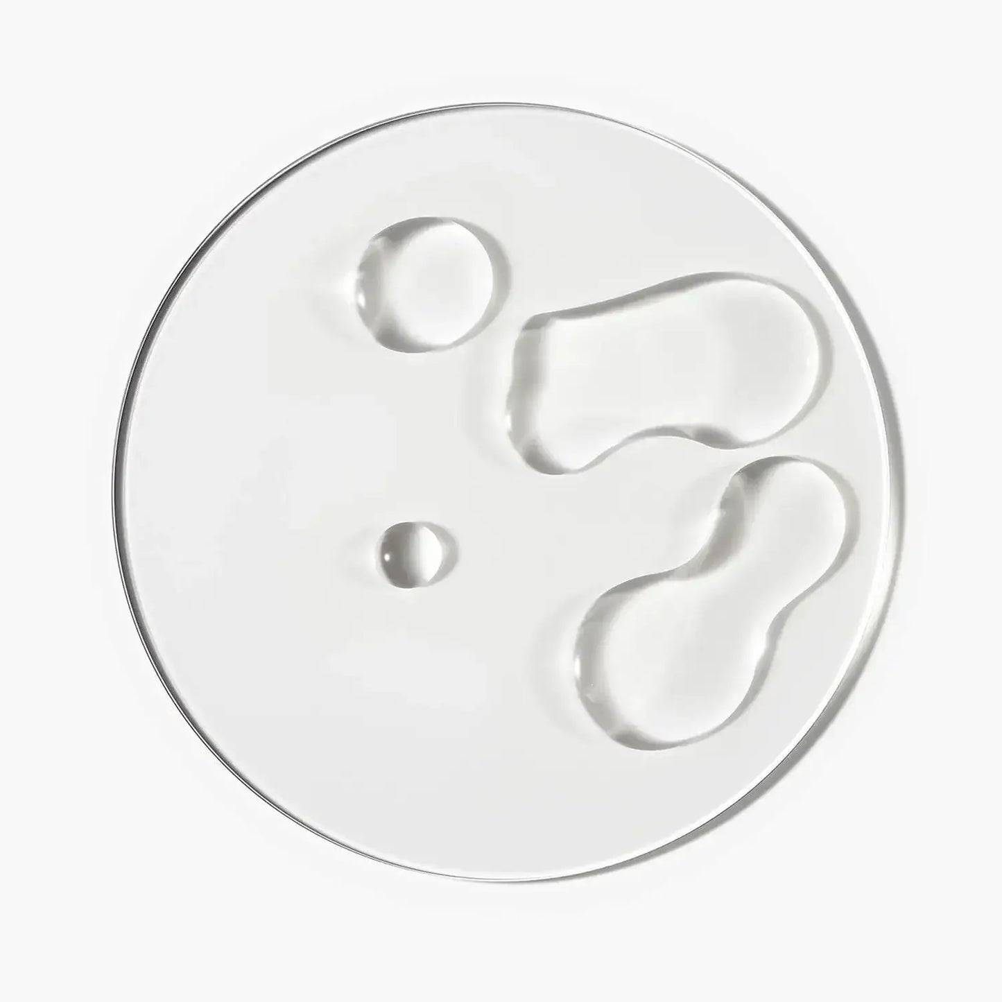Clear gel serum drops showcasing textures for The INKEY List Caffeine Stimulating Scalp Treatment.