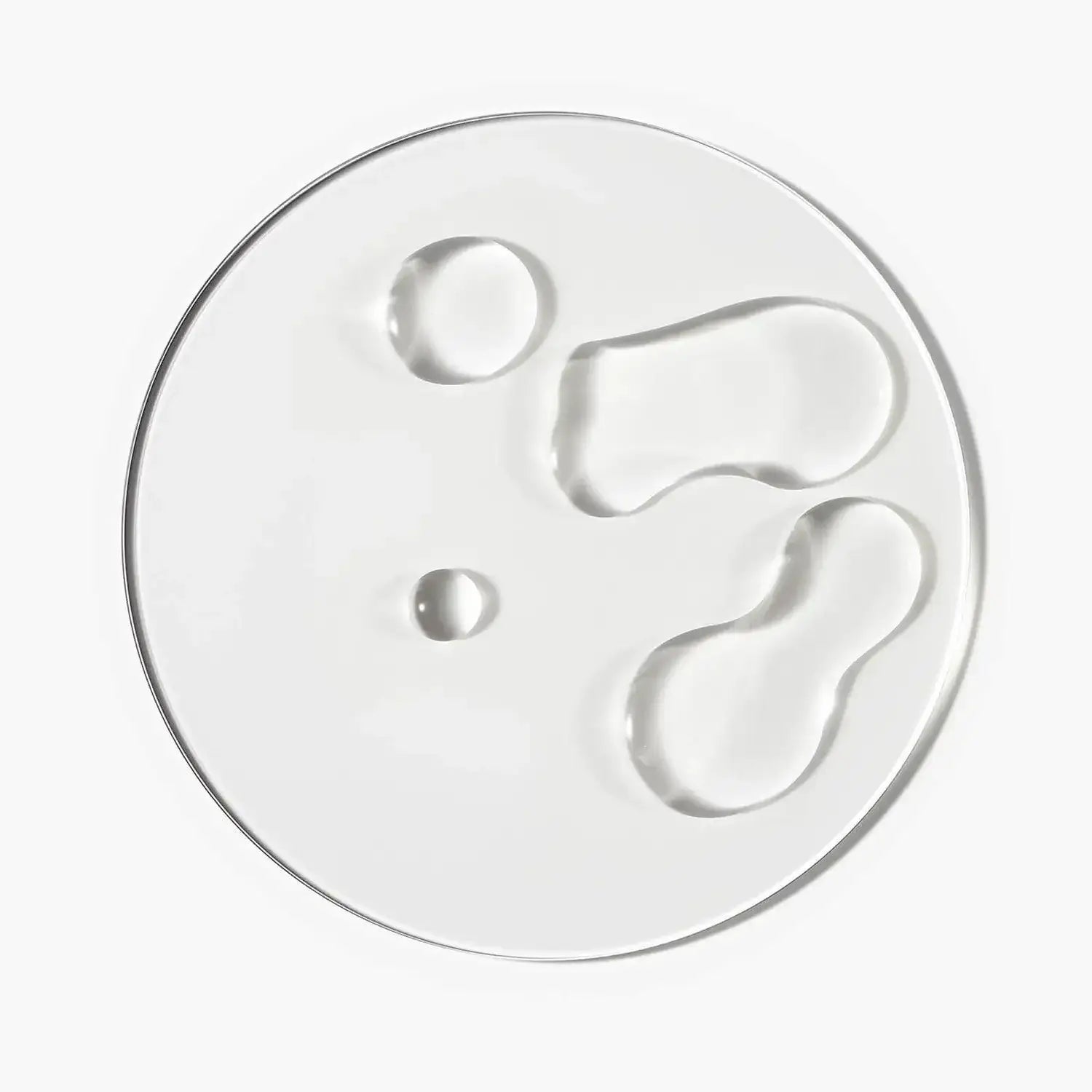 Clear gel serum drops showcasing textures for The INKEY List Caffeine Stimulating Scalp Treatment.