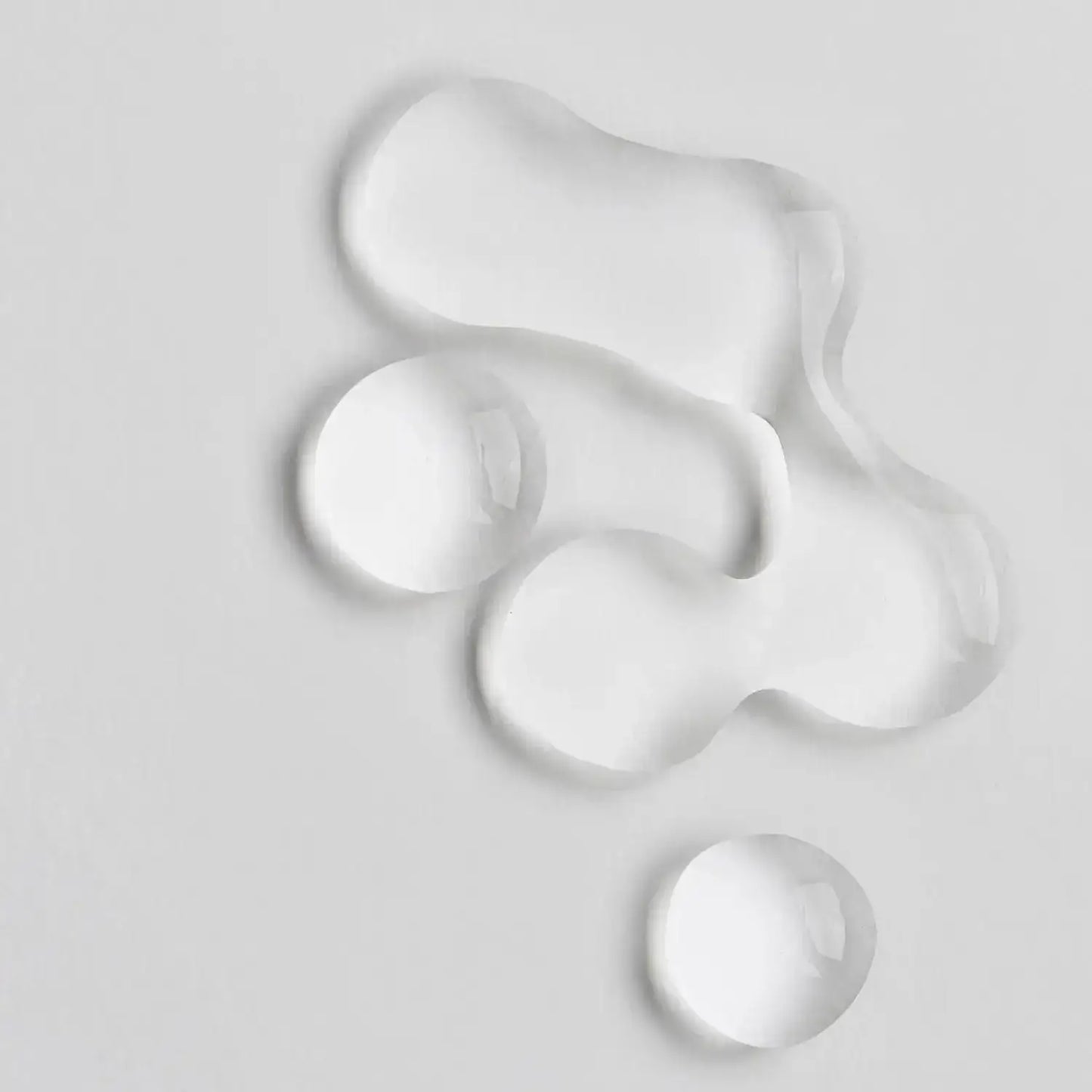 Close-up of clear gel drops representing The INKEY List Collagen Peptide Serum's lightweight formula.