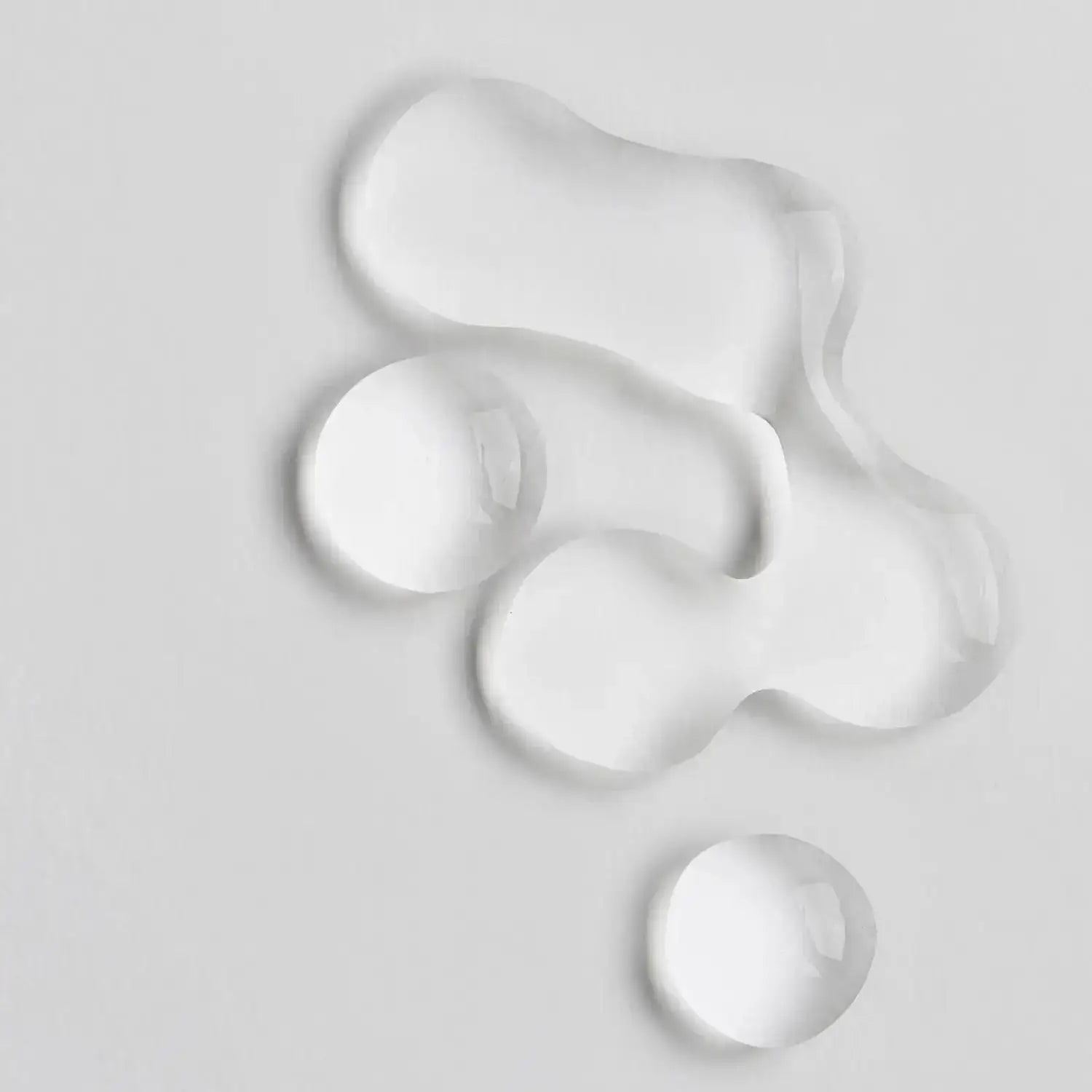 Close-up of clear gel drops representing The INKEY List Collagen Peptide Serum's lightweight formula.