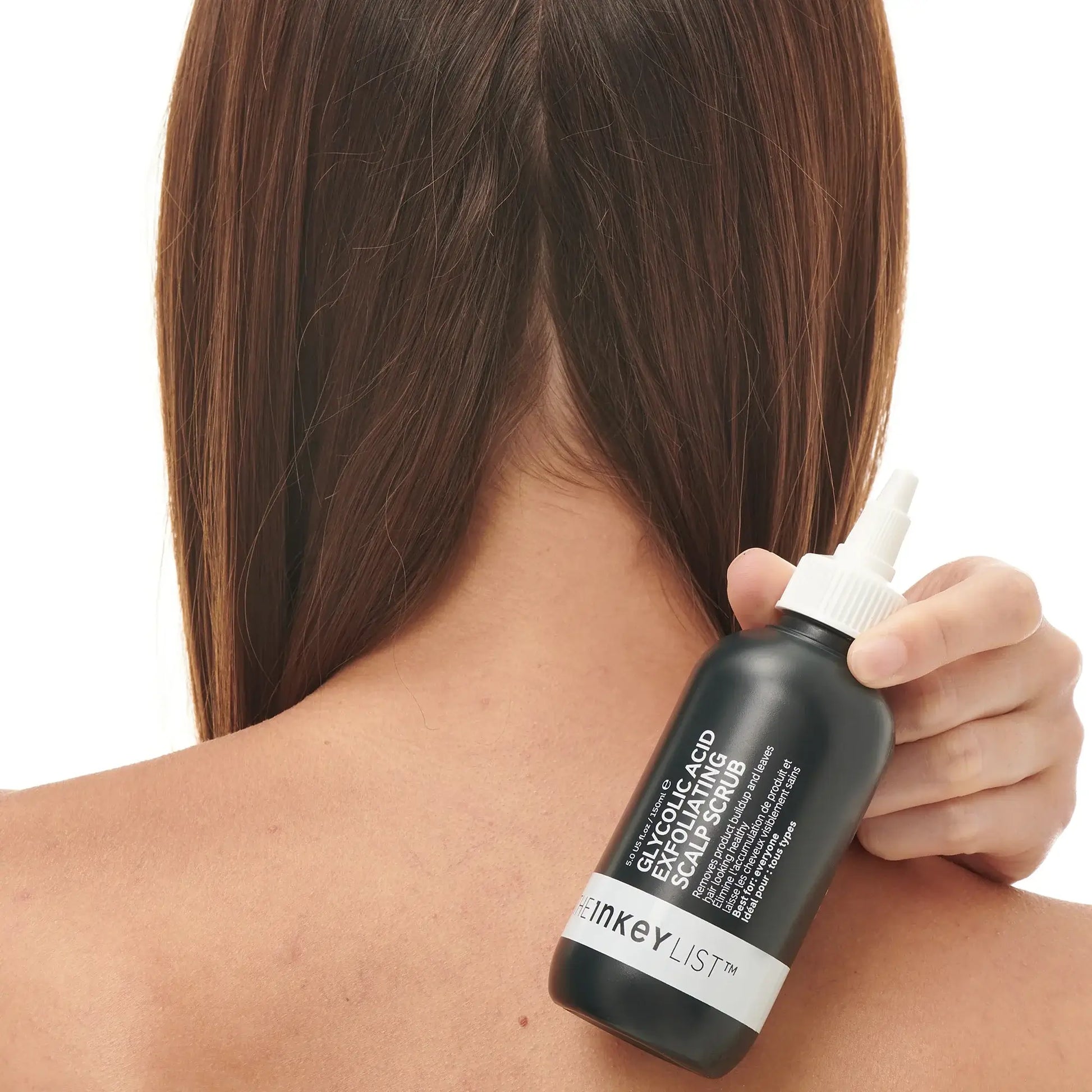 Glycolic Acid Exfoliating Scalp Scrub 150ml being applied to a woman's scalp for revitalization.