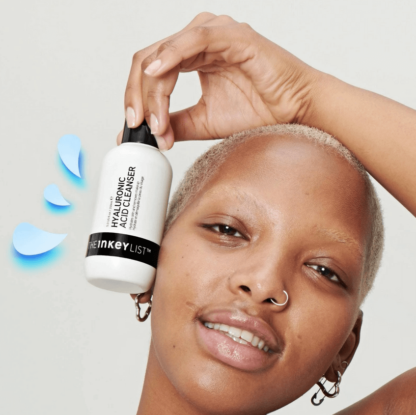 Model showcasing The INKEY List Hyaluronic Acid Cleanser 150ml, emphasizing hydration and fresh skin.