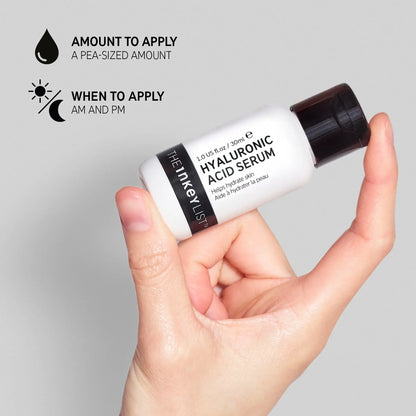 Hand holding The INKEY List Hyaluronic Acid Serum bottle with application tips for oily skin.
