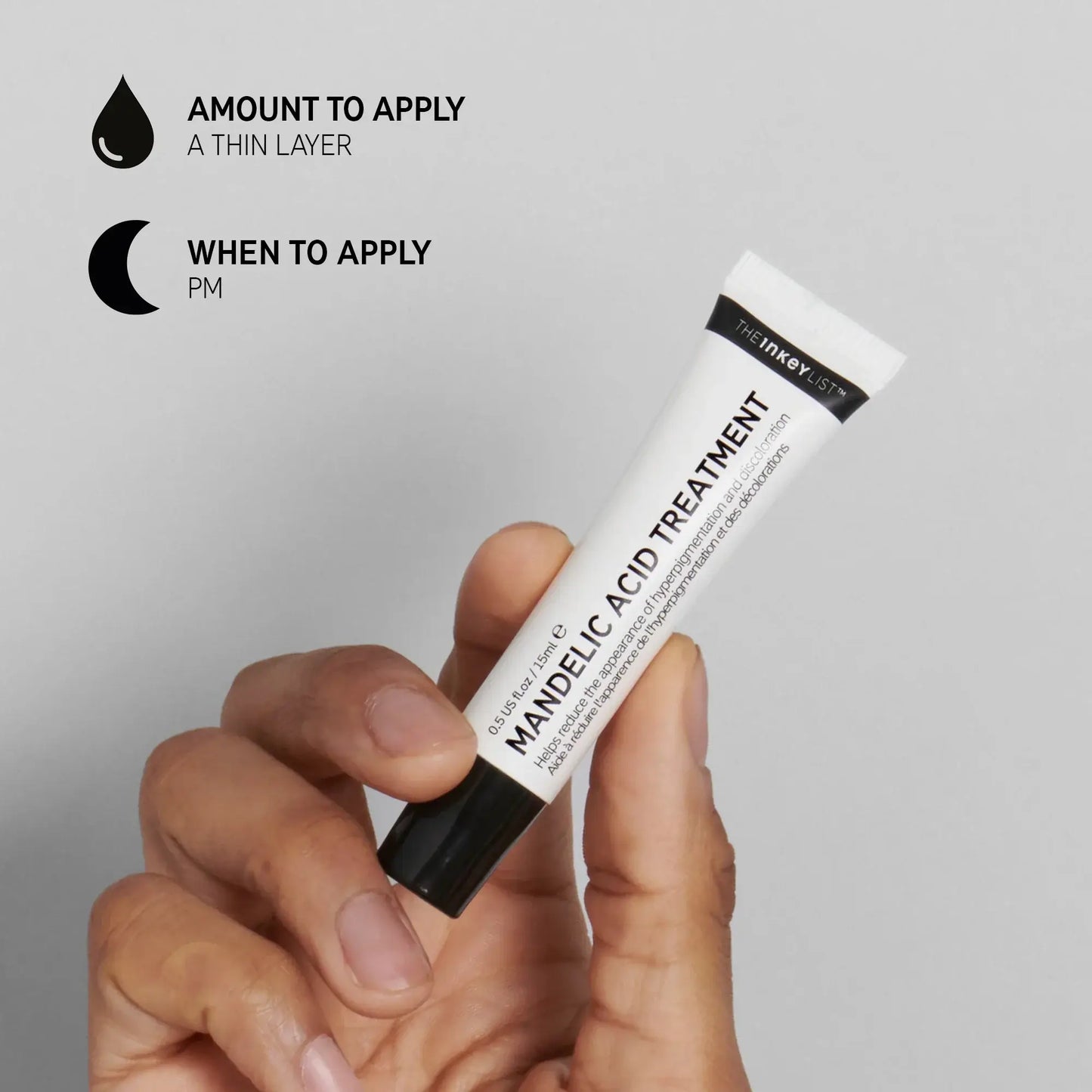 The Inkey List Mandelic Acid Treatment in hand, instructions for use and application details.