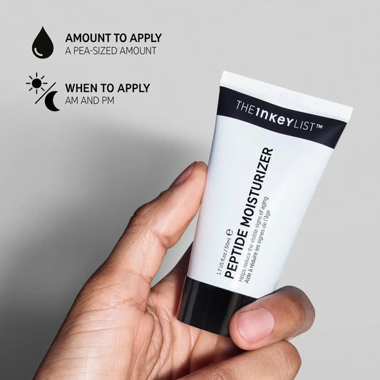 A hand holding The INKEY List Peptide Moisturizer tube, showing application tips for best results.
