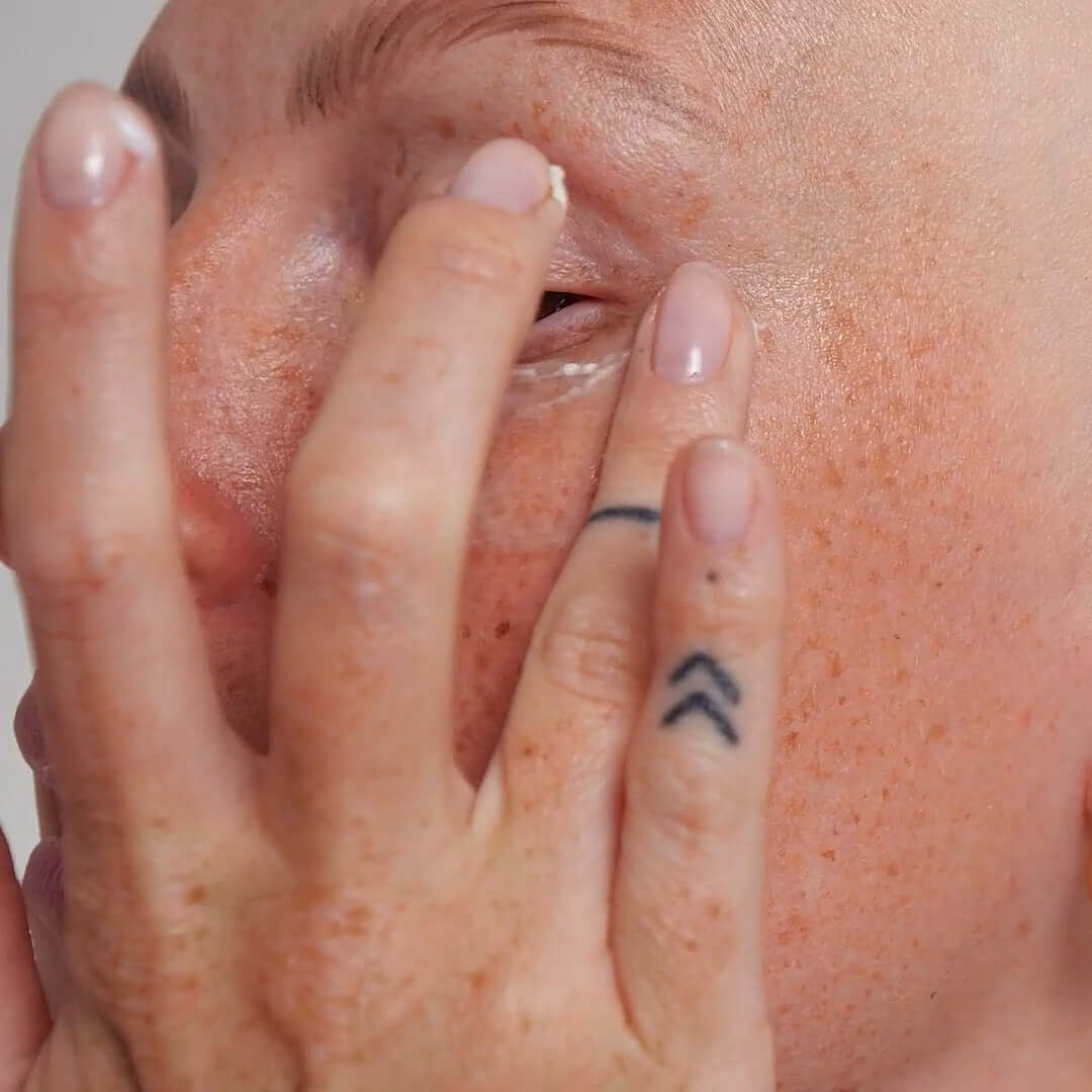 Applying The INKEY List Retinol Duo Bundle for youthful, radiant skin on sensitive areas.