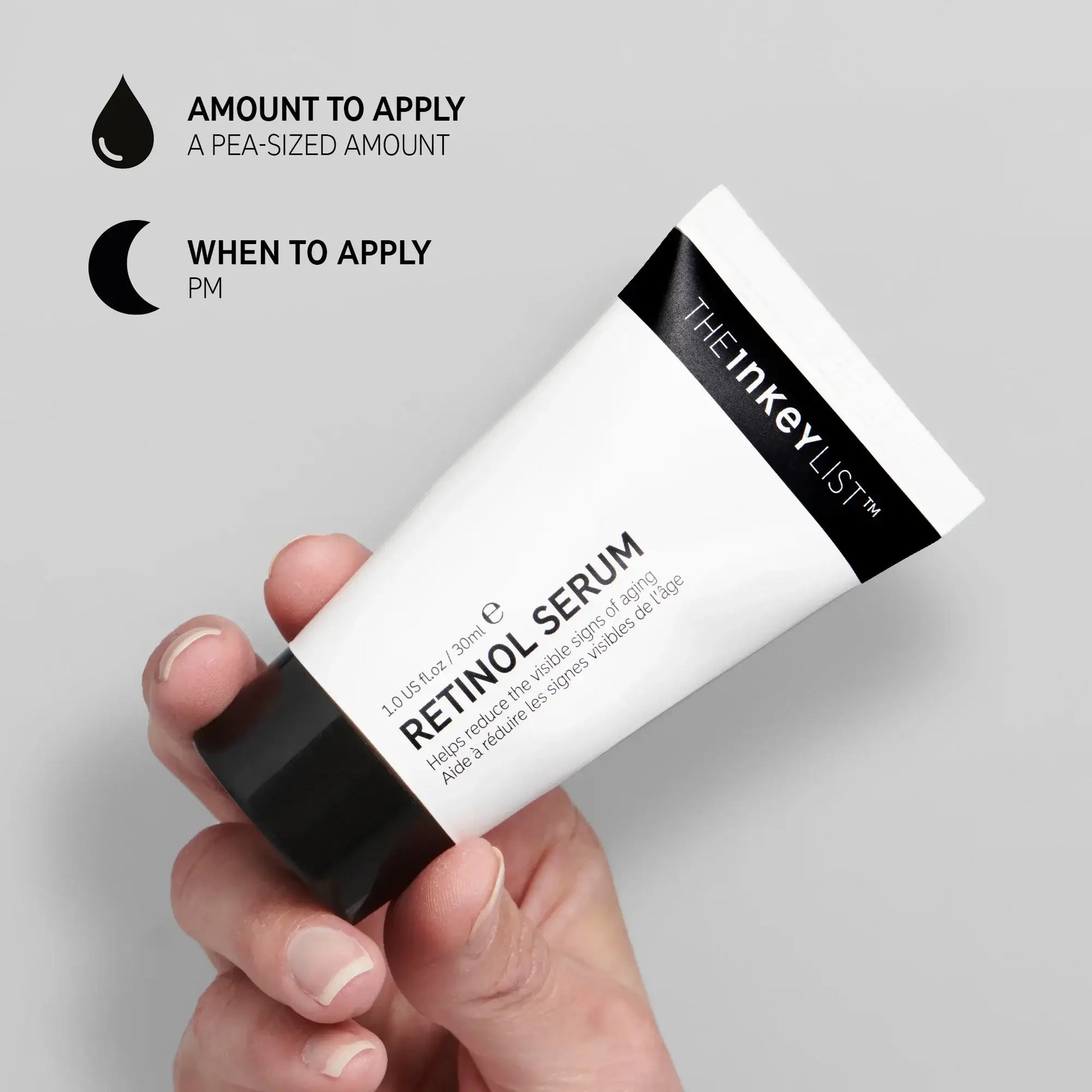 A hand holding The INKEY List Retinol Serum tube, detailing amount to apply and best time for use, promoting youthful skin.