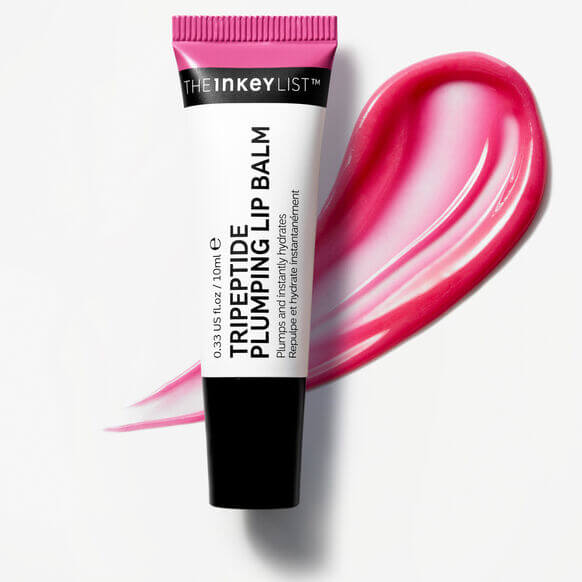 The INKEY List Tripeptide Plumping Lip Balm 10ml tube with vibrant pink lip balm swatch.