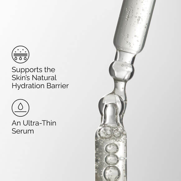 Close-up of an ampoule with text about supporting the skin's natural hydration barrier.