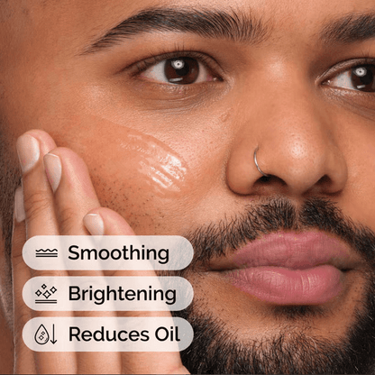 Close-up of a man applying a The Ordinary serum highlighting smoothing, brightening, and oil-reducing benefits.