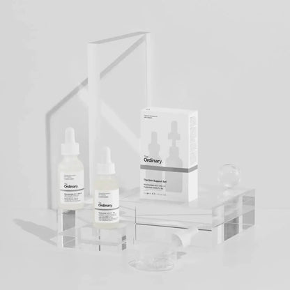 The Ordinary The Skin Support Set displayed with two serums and packaging on a clear surface, showcasing hydrating skincare.