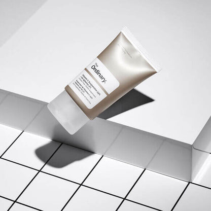 The Ordinary Vitamin C Suspension 23% + HA Spheres 2% 30ml tube on a modern tile surface.