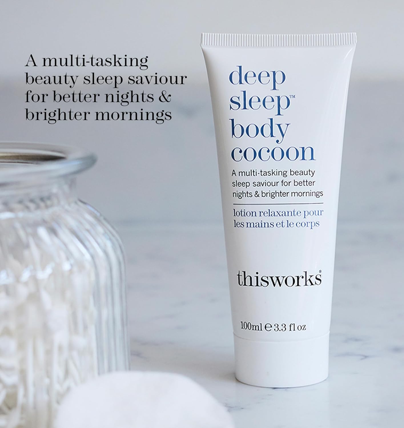 Tube of 'deep sleep body cocoon' lotion by 'thisworks' on a light background