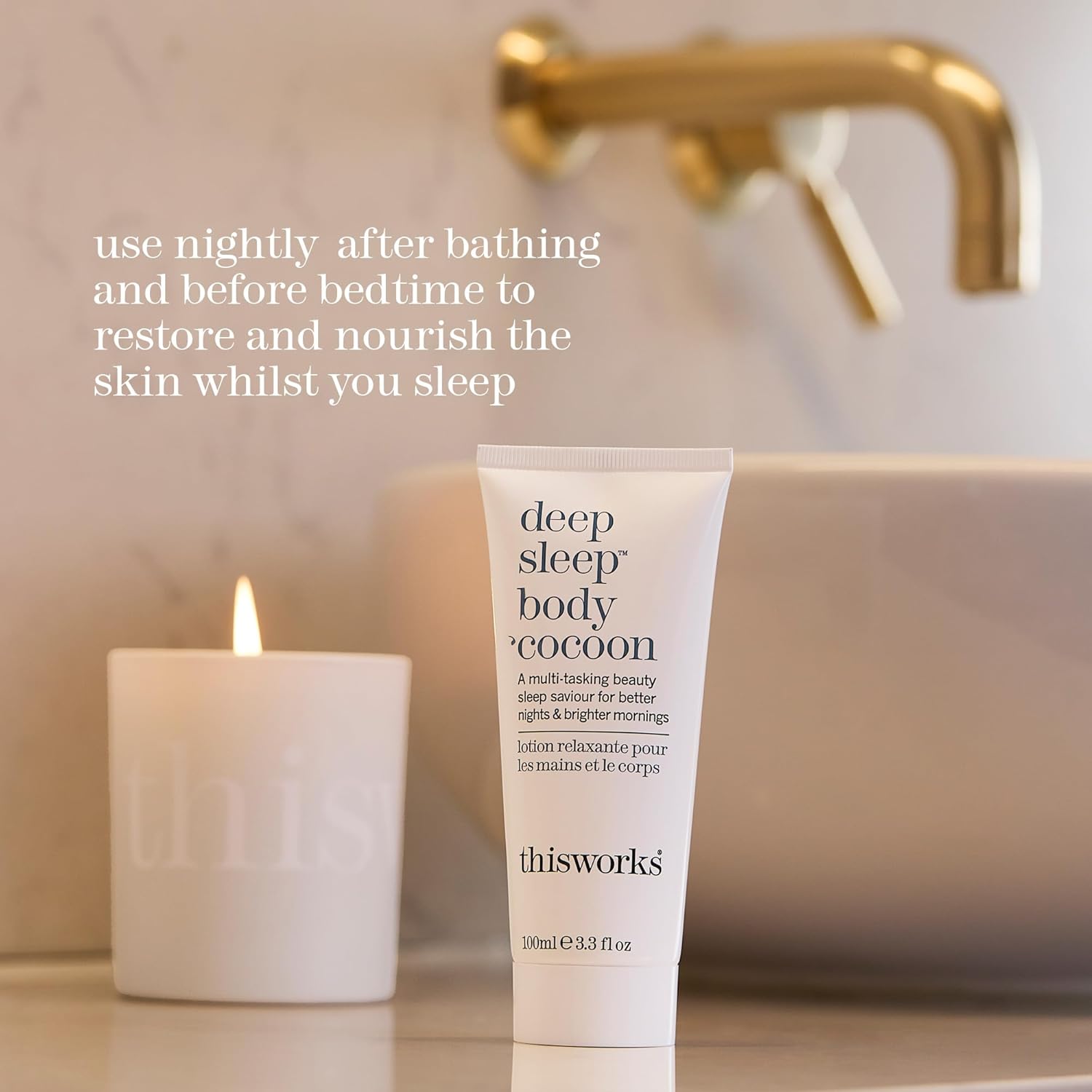thisworks Tube of 'deep sleep body cocoon' lotion with a candle and bathtub in the background