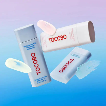 TOCOBO skincare products including sun cream and hyaluronic acid essence against a colorful background.
