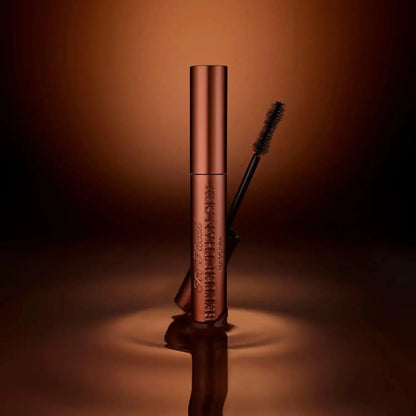 Too Faced Better Than Sex Mascara in Chocolate 8ml, featuring a sleek tube and brush, on a reflective dark background.