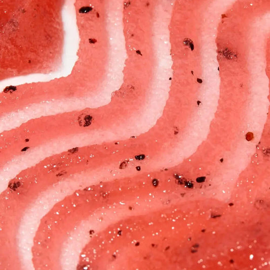 Close-up of TREE HUT Sugar Scrub Watermelon showcasing textured layers of pink and red sugar scrub.