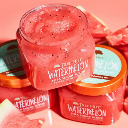Jar of Tree Hut Watermelon Shea Sugar Scrub with watermelon slices in the background