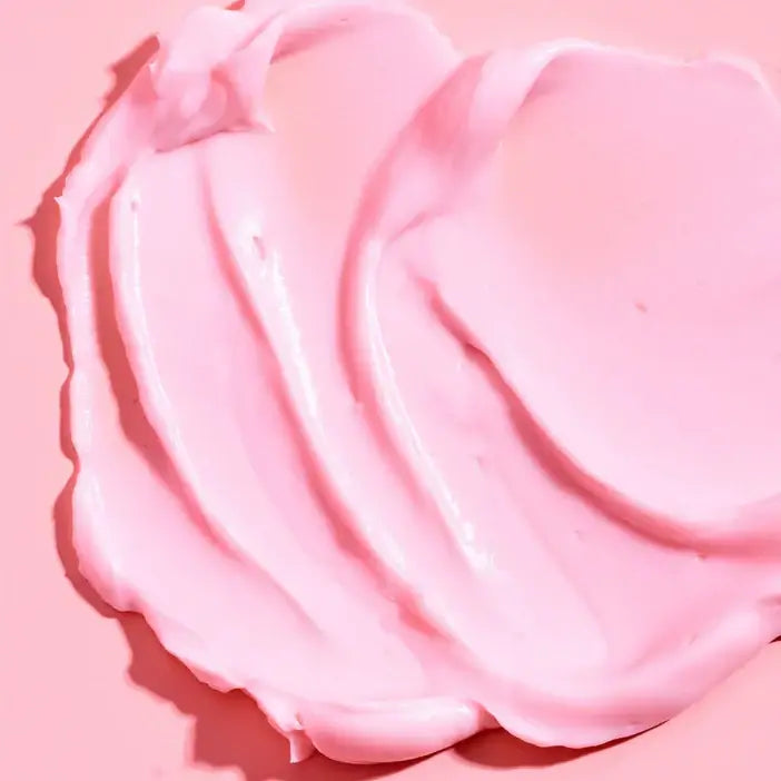 TREE HUT Whipped Body Butter Moroccan Rose creamy texture on a pink surface for luxurious skincare.