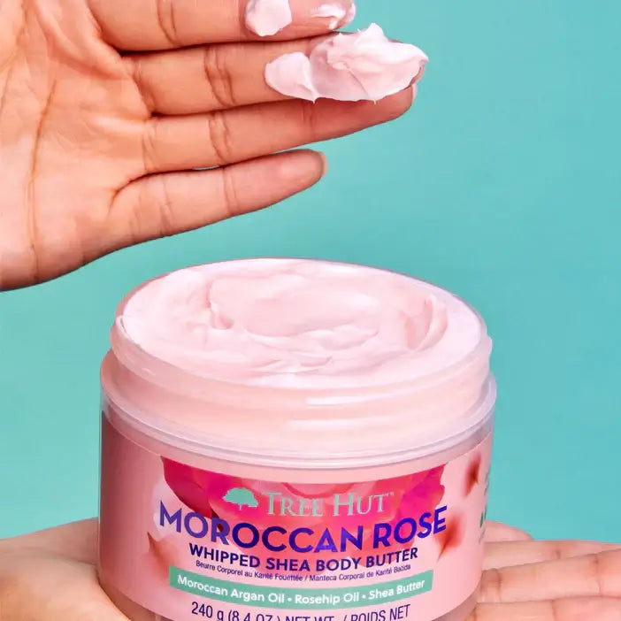 TREE HUT Whipped Body Butter Moroccan Rose with creamy texture in a jar held in hands.
