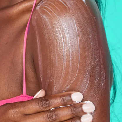 Person applying TREE HUT Whipped Body Butter Moroccan Rose to skin for hydration and smoothness.