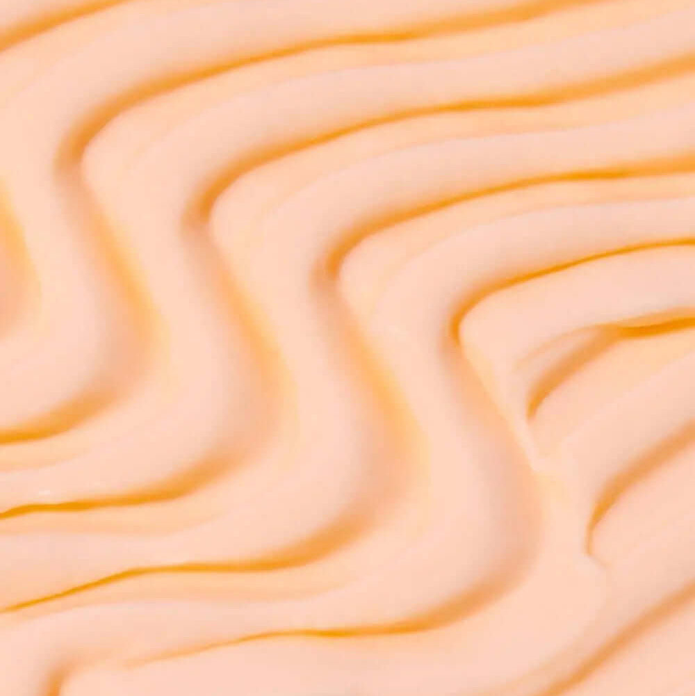 Tree Hut Whipped Body Butter Vitamin C texture in soft, creamy swirls, showcasing its hydrating formula.