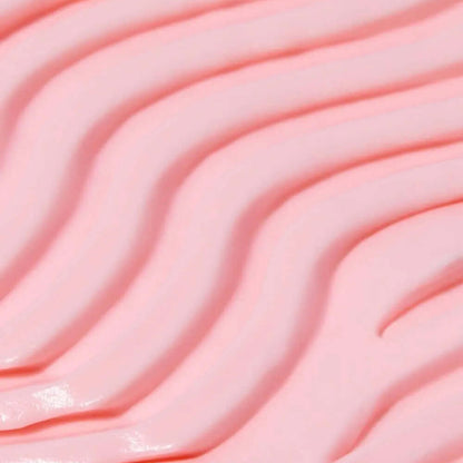 Close-up of smooth, pink TREE HUT Whipped Body Butter with wavy texture, showcasing its creamy consistency.