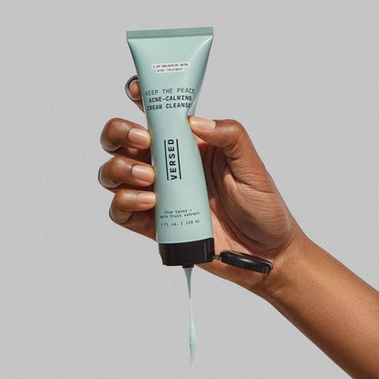 VERSED Keep The Peace Blemish-Calming Cream Cleanser in hand, showcasing soothing formula for acne-prone skin.