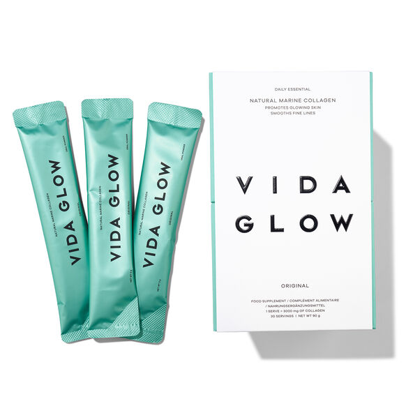 Three Vida Glow packets with a box on a white background