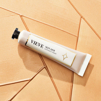VIEVE Skin Dew 20ml: liquid highlighter for radiant skin on a textured background.