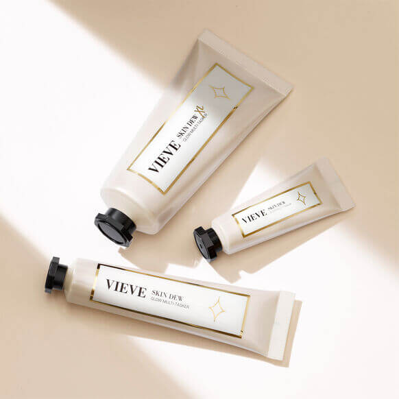 Three VIEVE Skin Dew products in elegant packaging on a beige background, perfect for radiant and healthy skin.