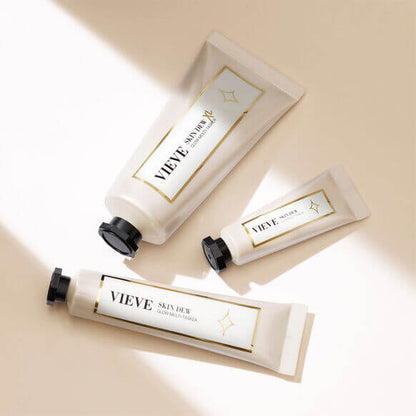 Three VIEVE Skin Dew products in elegant packaging on a beige background, perfect for radiant and healthy skin.