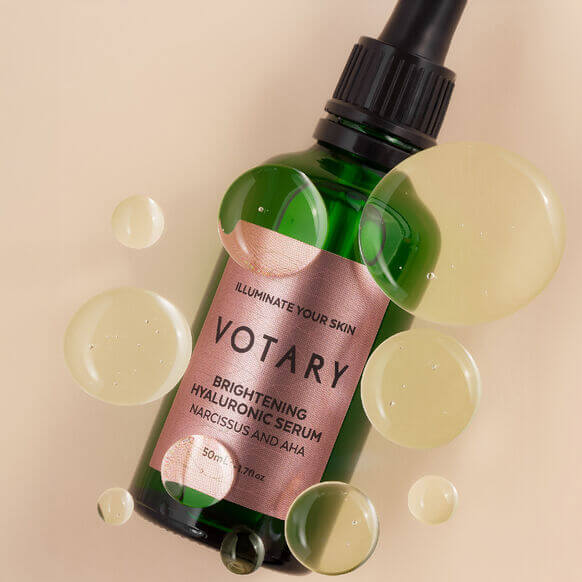 Votary Brightening Hyaluronic Serum 50ml bottle with bubbles, promoting luminous and hydrated skin.