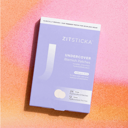Zitsticka undercover blemish patches packaging on a gradient pink and orange background