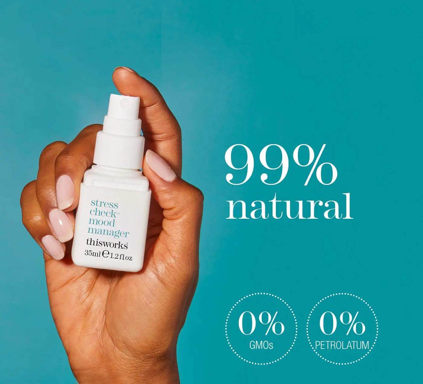 thisworks Stress Check Mood Manager 35ml bottle held by hand, featuring 99% natural ingredients and no GMOs or petroleum.