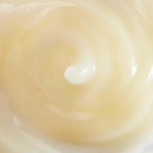 Creamy swirl of ESPA Yuzu and Ginger Cleansing Sorbet, showcasing its smooth texture and nourishing ingredients.