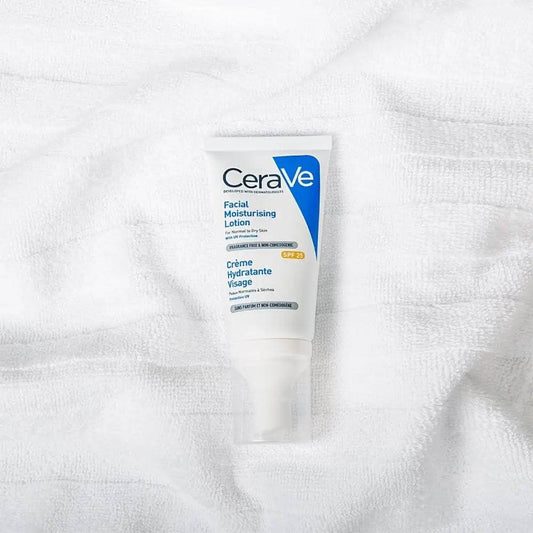 CeraVe Facial Moisturising Lotion SPF25 50ml on a soft white towel, designed for daily hydration and skin protection.