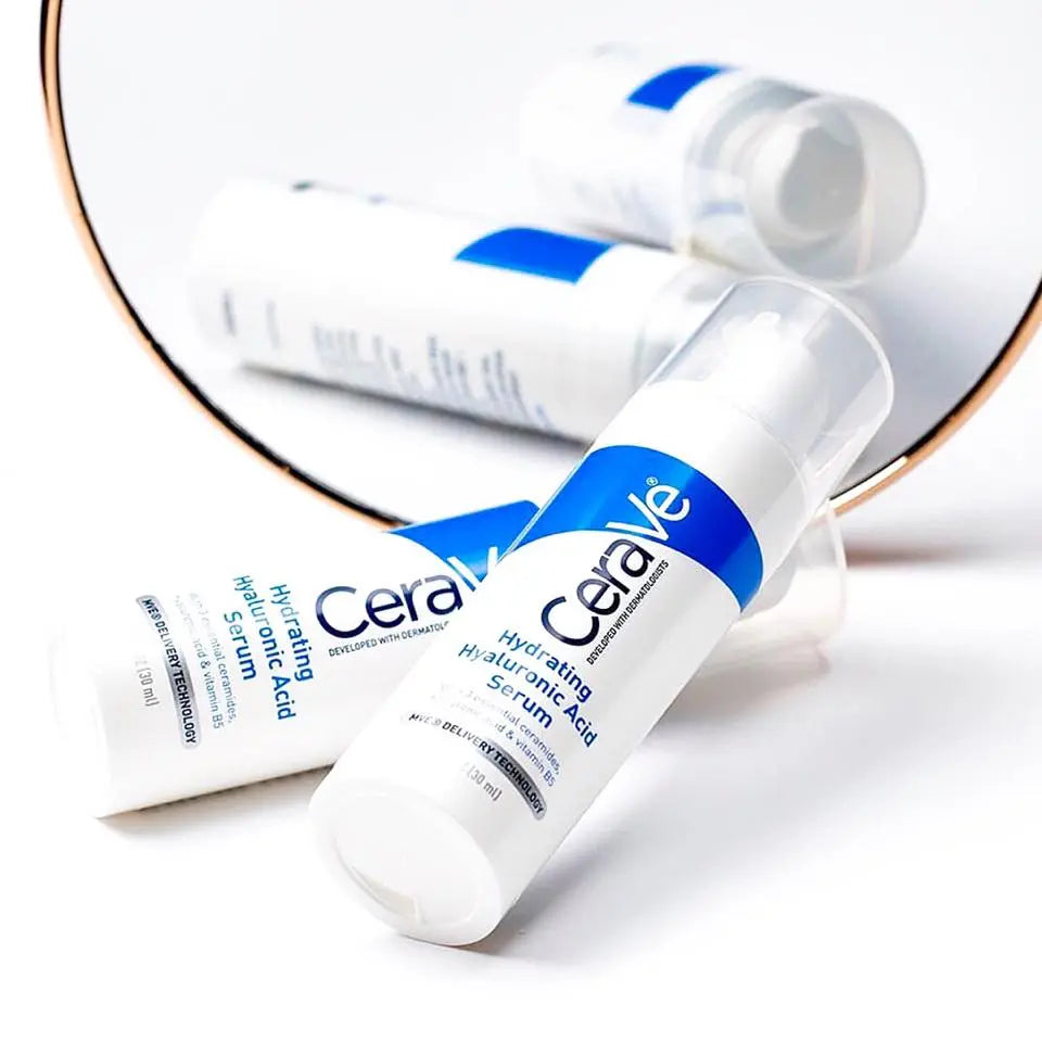 CeraVe Hydrating Hyaluronic Acid Serum bottles reflected in a mirror, showcasing the lightweight moisturizer for skin hydration.