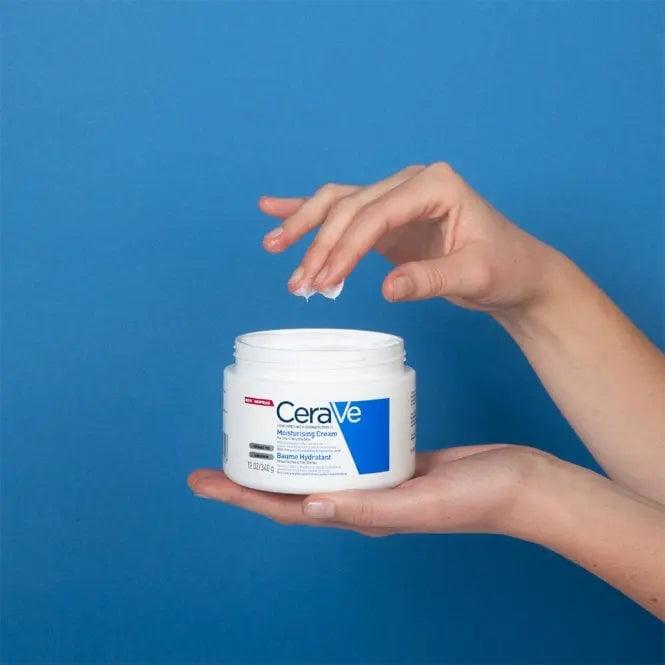 CeraVe Moisturizing Cream 340g in hand against a blue background, perfect for dry skin hydration.