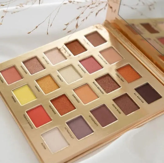 Iconic London Sunset to Sunrise Eyeshadow Palette with 20 versatile shades, including warm corals and glam golds.