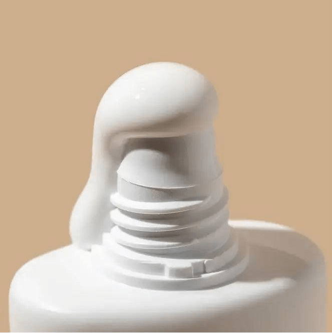 Close-up of Alpha H Daily Essential Moisturiser SPF 50+ with creamy formula ready for application.