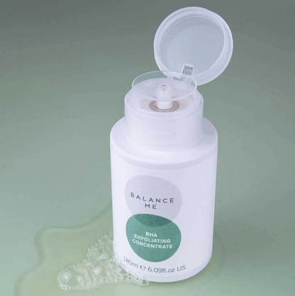 Balance Me BHA Exfoliating Concentrate 180ml bottle with cap open, designed for blemish-prone skin, on a soft green background.