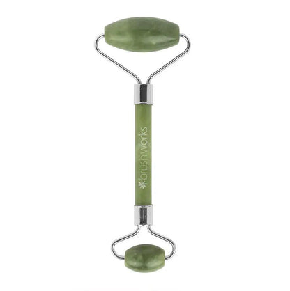 Brushworks HD Jade Roller, a green facial roller for enhancing skin radiance and reducing puffiness.