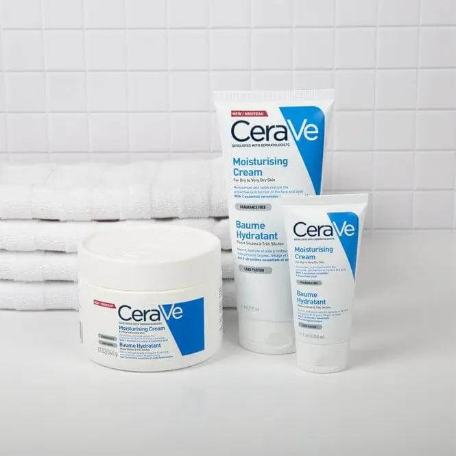 CeraVe Moisturising Cream 340g with tubes, providing hydration for dry skin, stacked near white towels.