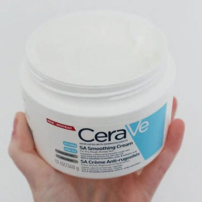 CeraVe Smoothing Cream 340g in hand, designed to hydrate and exfoliate dry, rough skin with Salicylic Acid and Urea.