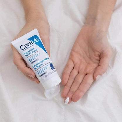 CeraVe Soothing & Repairing Hand Cream 50ml in a hand, showcasing moisturizing benefits for dry skin.