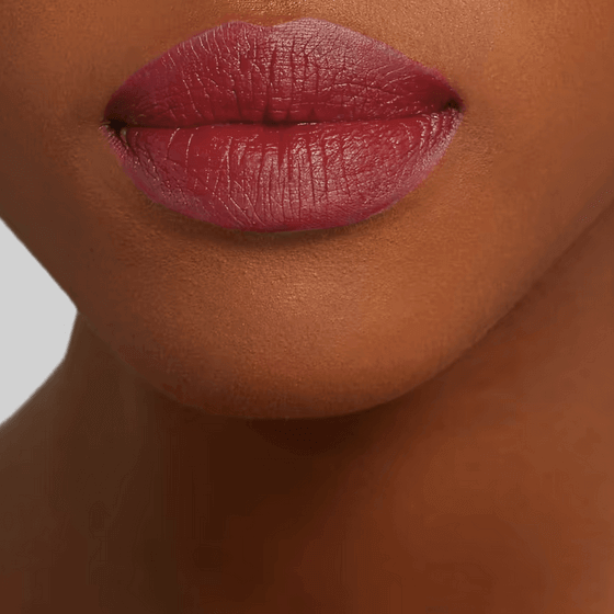 Close-up of lips wearing Charlotte Tilbury Hot Lips 2 Viva Le Vergara, a soft-wine matte lipstick shade.