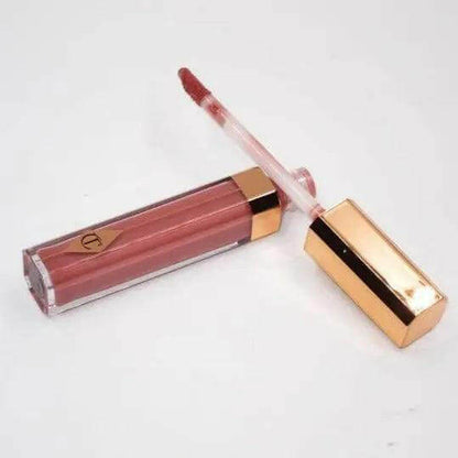 Charlotte Tilbury Lip Lustre in Pillow Talk, nude-pink lip gloss with a shiny finish and applicator.
